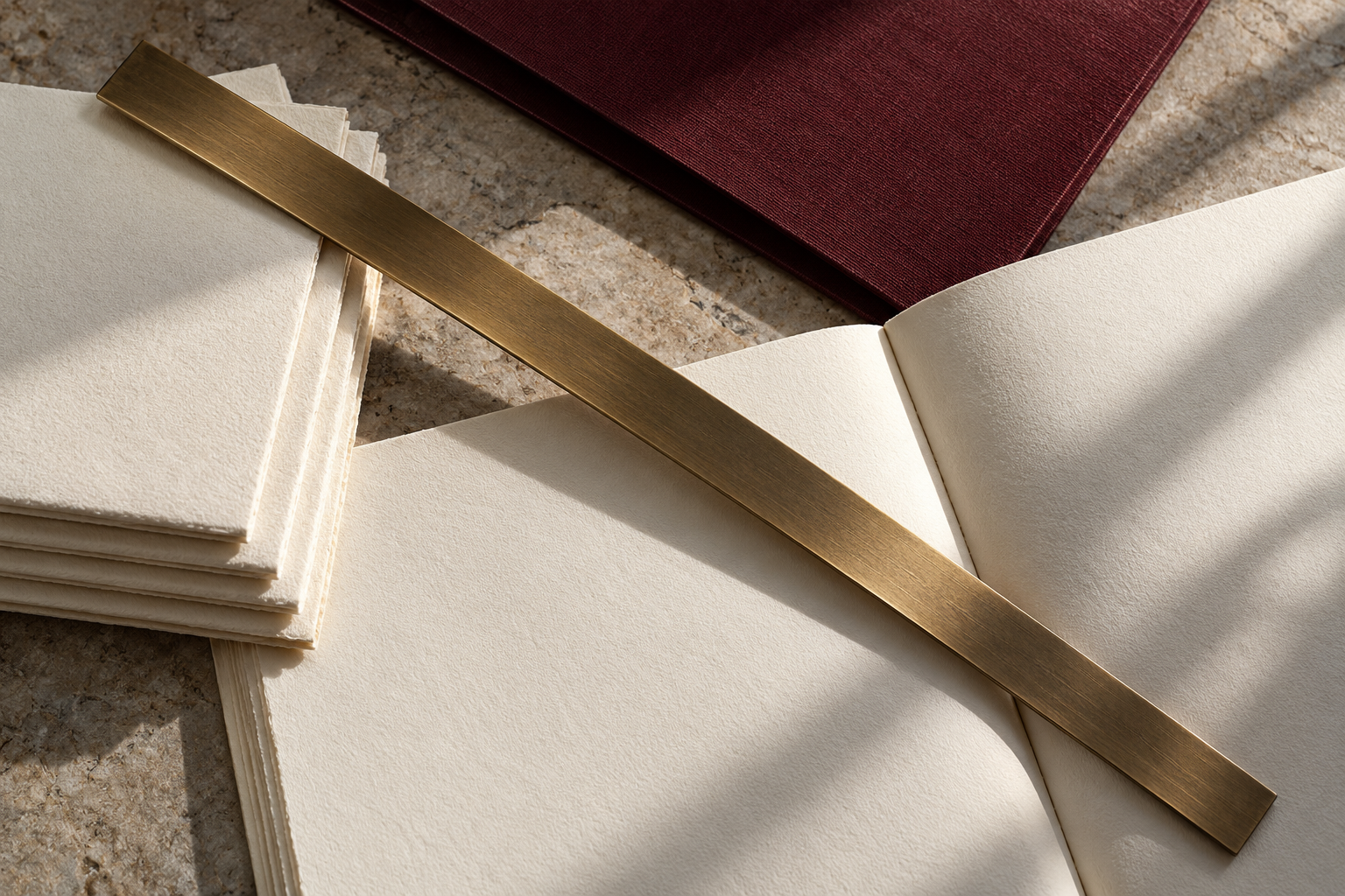 Illustrative study of papers and a bronze straightedge